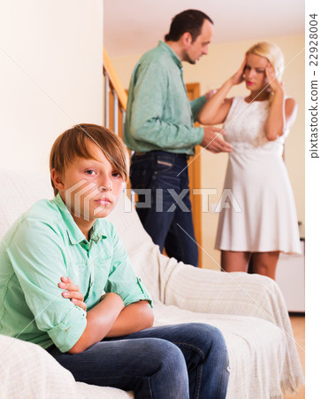 Adults quarrel and sad boy 22928004