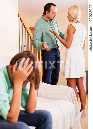 Adults quarrel and sad boy 22928005