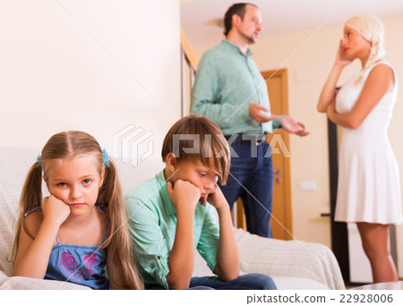 Sad siblings and quarrel parents 22928006