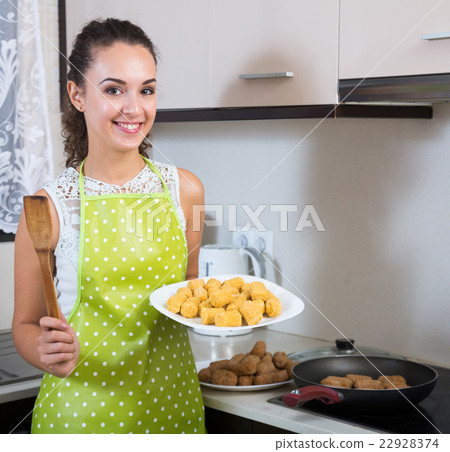woman frying filled croquettes 22928374