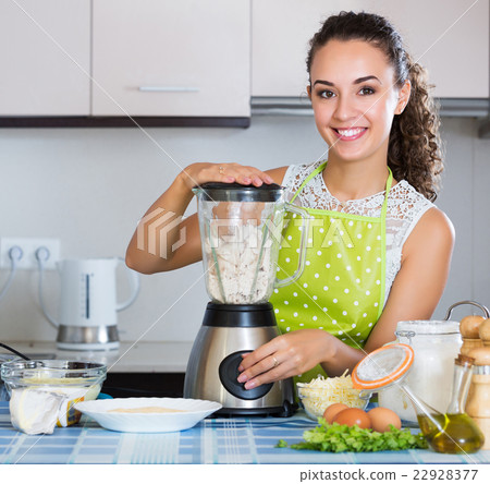 Girl preparing chicken pate 22928377