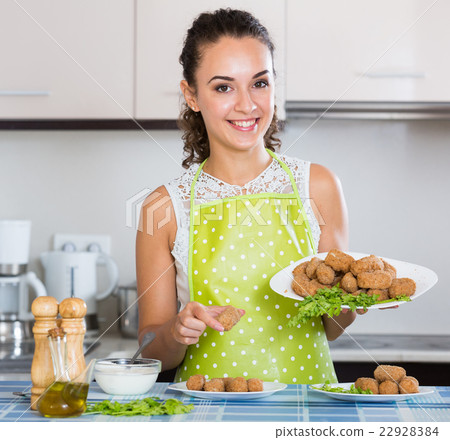 woman posing with plate of deep-fried kroketten woman posing with plate of deep-fried kroketten 22928384