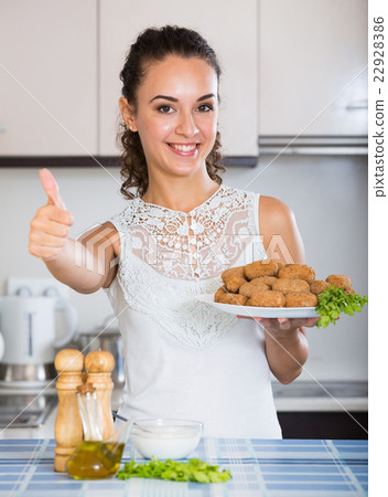 girl with tasty breadcrumbed crocchette 22928386