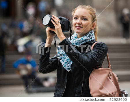 girl taking pictures of sights at city excursion girl taking pictures of sights at city excursion 22928690