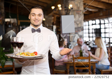 Portrait young male waiter 22928752
