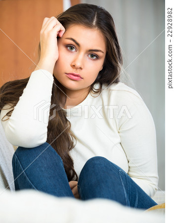 Upset adult girl at home. 22928982
