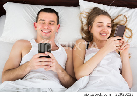 Adults social networking with phones 22929225