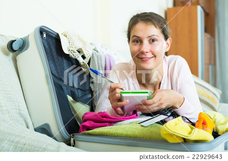 brunette planning vacation with notebook brunette planning vacation with notebook 22929643