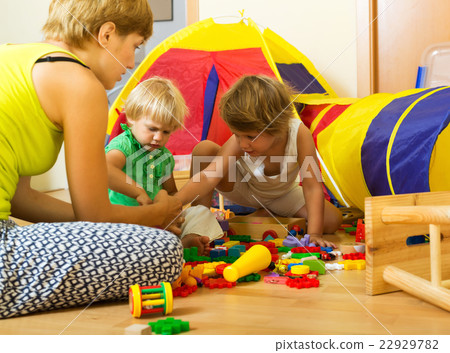 Mother and children playing Mother and children playing 22929782