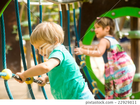 Little sisters at playground in park 22929811