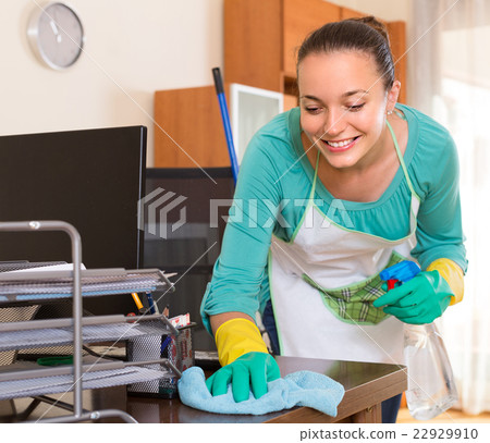 Woman cleaning office room. Woman cleaning office room. 22929910