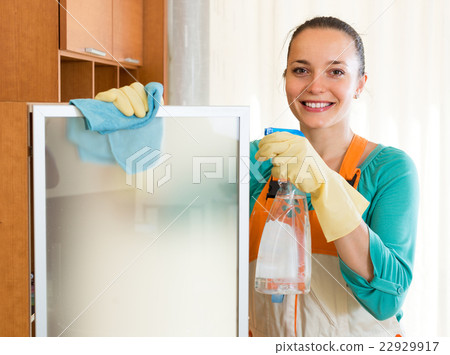Woman cleaning at the office Woman cleaning at the office 22929917