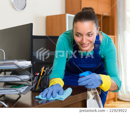 Woman cleaning office room 22929922