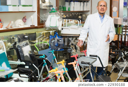 Orthopaedist posing near orthopaedic equipment 22930188