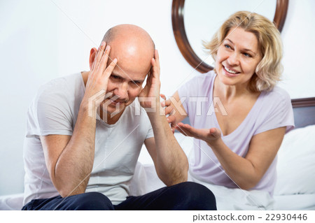 Positive smiling mature girl supporting frustraited boyfriend Positive smiling mature girl supporting frustraited boyfriend 22930446