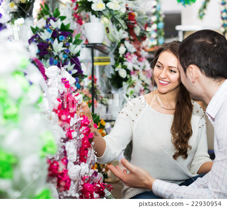 Couple buying bouquet in shop Couple buying bouquet in shop 22930954