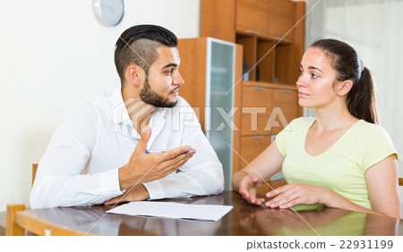 couple with documents in apartment 22931199