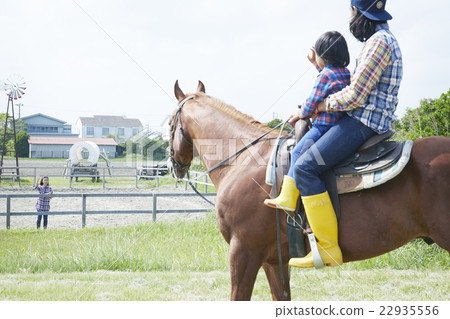 Parent and child riding Parent and child riding 22935556