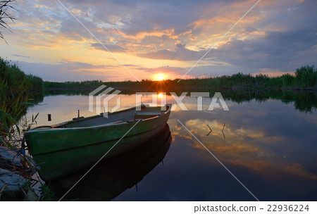 fisherman boat at sunset time 22936224