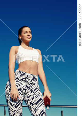 Woman runner enjoying rest outdoors 22938822