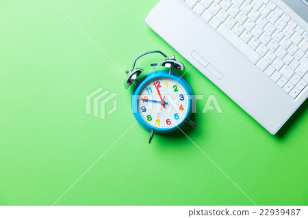 clock and laptop 22939487