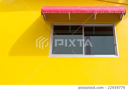 WIndow on yellow wall with red splashboard WIndow on yellow wall with red splashboard 22939779