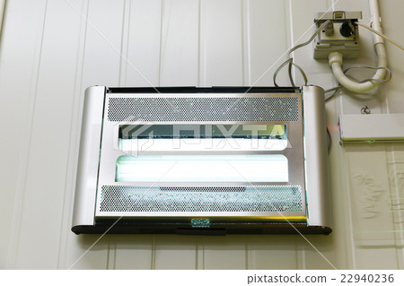 Electronic bug trap on wall 22940236