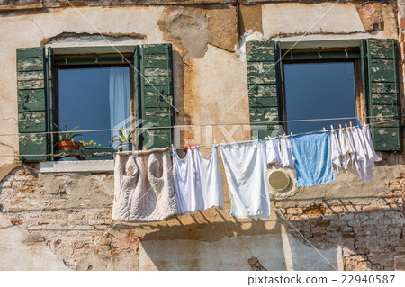Venetian windows with the laundry drying on a wire 22940587