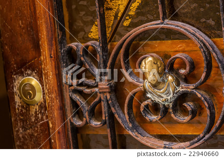 Door handle on old venitian wooden door 22940660