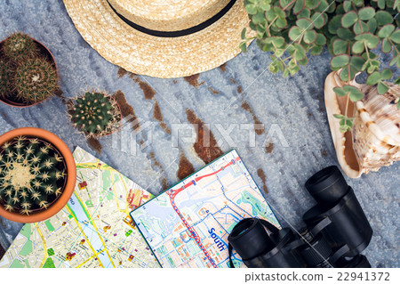 Binoculars, straw hat, map. Traveler set, flat lay Binoculars, straw hat, map. Traveler set, flat lay 22941372