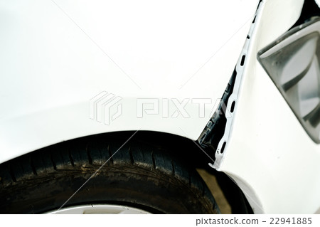 Dented and opening wound on a damaged white car Dented and opening wound on a damaged white car 22941885