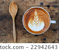 A cup of coffee on old wood table 22942643