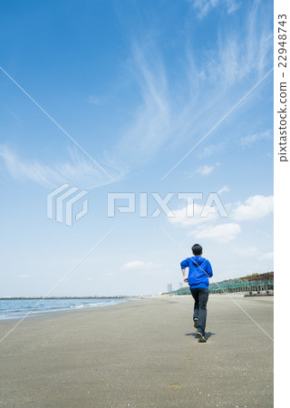 Young people running on the beach Young people running on the beach 22948743