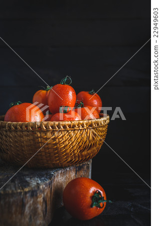 Red Tomatoes on the dark background Red Tomatoes on the dark background 22949603