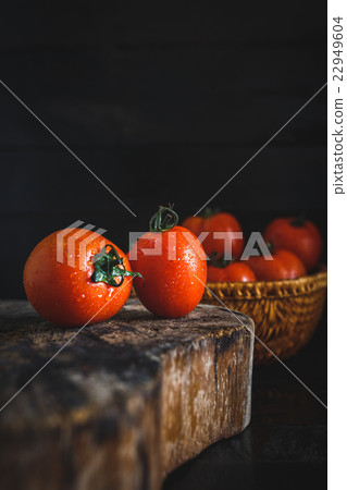 Red Tomatoes on the dark background Red Tomatoes on the dark background 22949604