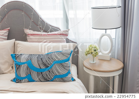 colorful pillows on bed in luxury girl's bedroom 22954775