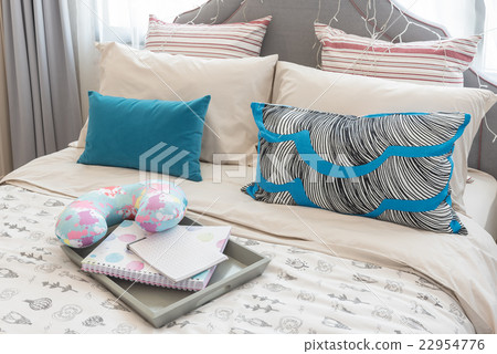 colorful pillows on bed in luxury girl's bedroom 22954776