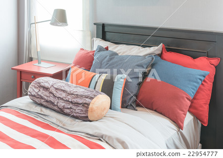 colorful pillows on bed in single bedroom design 22954777