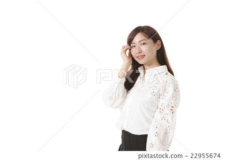 Young lady touching hair Young lady touching hair 22955674