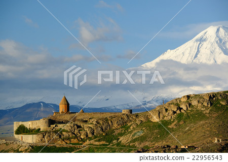Ancient monastery in front of mountain 22956543