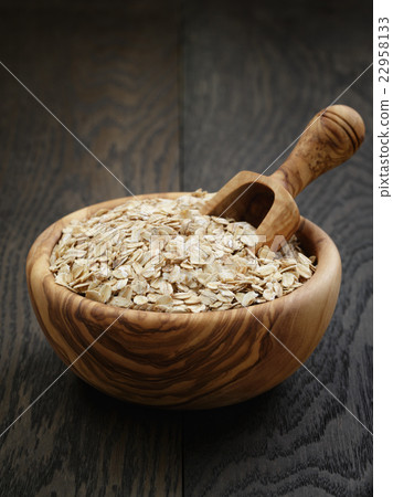 oat flakes in wood bowl on oak table 22958133