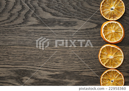 dried orange slices on dark oak table dried orange slices on dark oak table 22958360