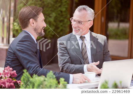 Colleagues sitting at the table 22961469