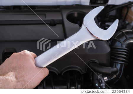 Wrench in hand with shallow depth of field 22964384