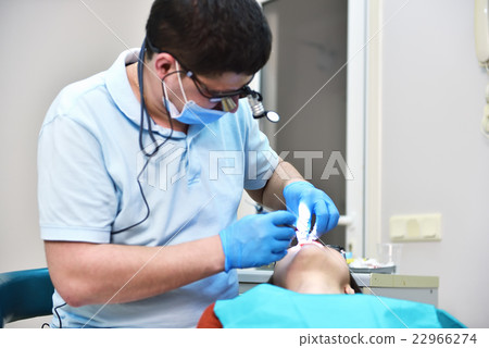 dentist examines teeth dentist examines teeth 22966274