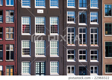 Traditional dutch buildings on canal in Amsterdam Traditional dutch buildings on canal in Amsterdam 22968322
