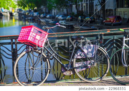 Colorful bikes on the bridge in Amsterdam 22968331