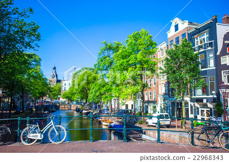 Beautiful canal and traditional bikes in old city Beautiful canal and traditional bikes in old city 22968343