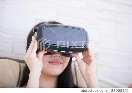 woman using VR headset glasses woman using VR headset glasses 22968501