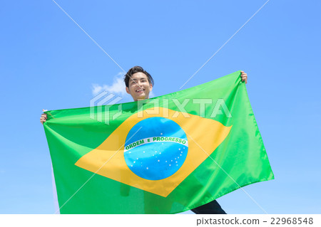Excited man holding brazil flag Excited man holding brazil flag 22968548